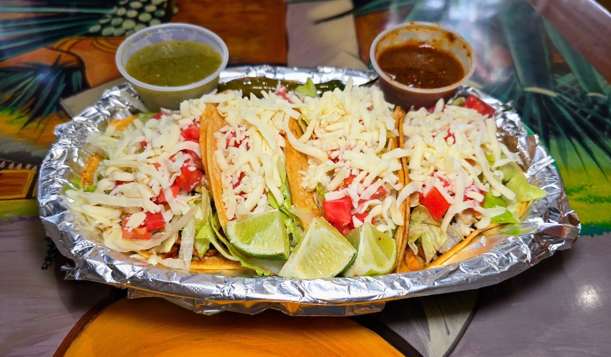 Tacos Supreme – Chicken, steak, al pastor, or barbacoa on corn tortillas, topped with shredded lettuce, diced tomatoes, and shredded cheese.