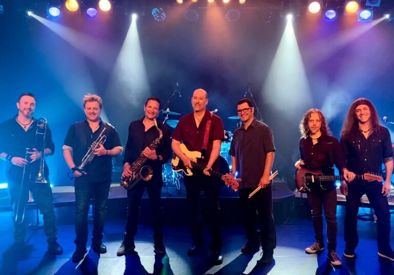 A full band photo of Beginnings, a cover-band of Chicago