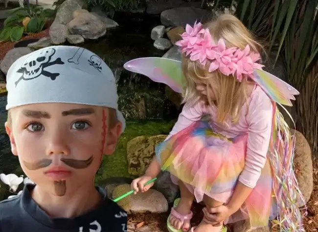 A little boy and girl during the annual pirate and fairy festival at mckee botanical garden.