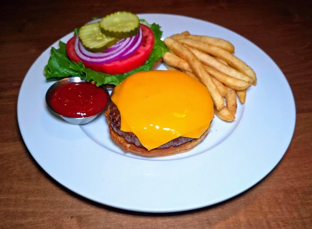 The SRP Burger at sean ryan pub vero. plated with fries.