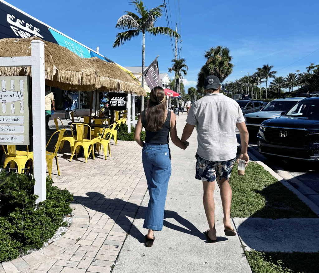 A couple walking along Ocean Drive